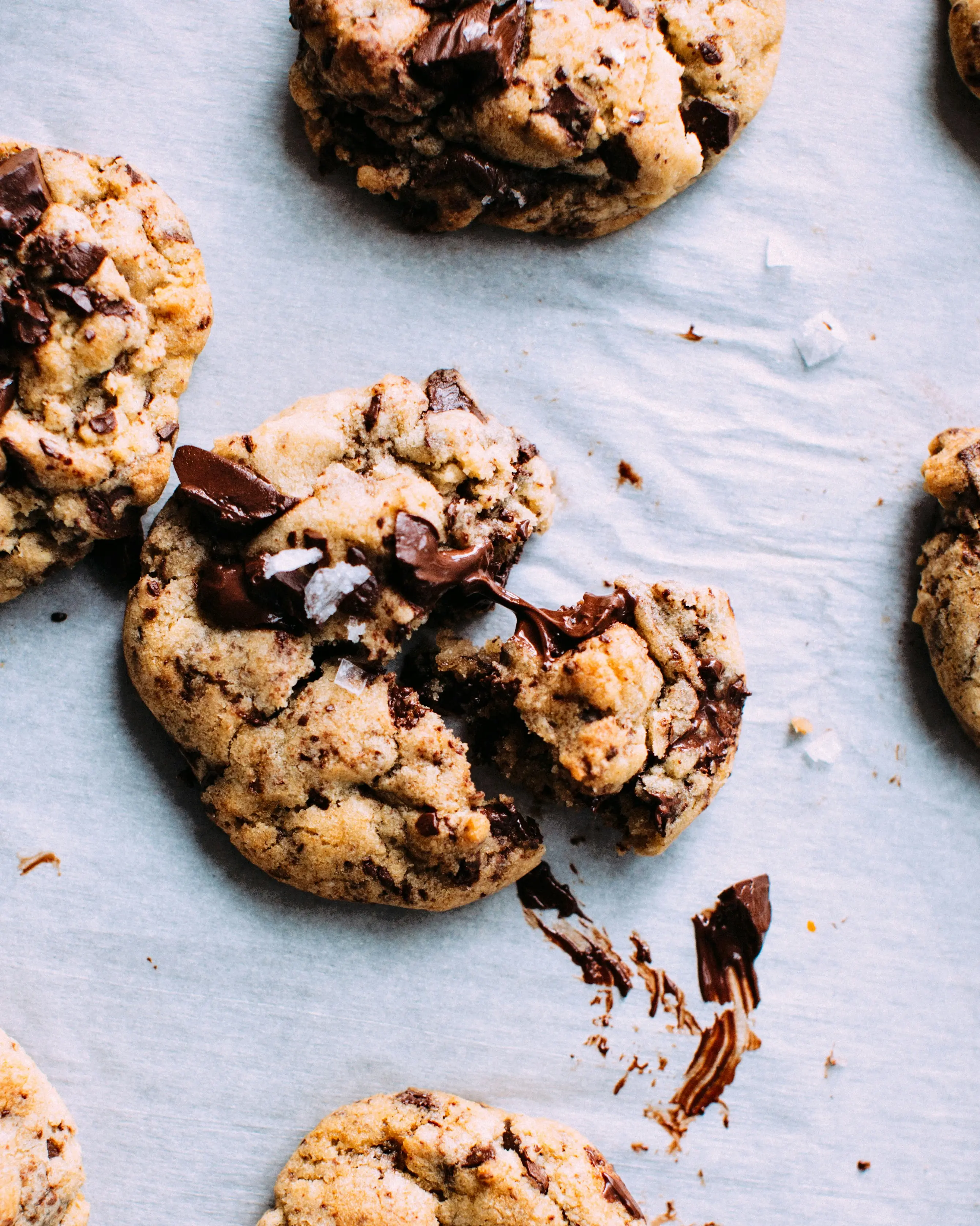Chocolate-chunk cookies on parchment